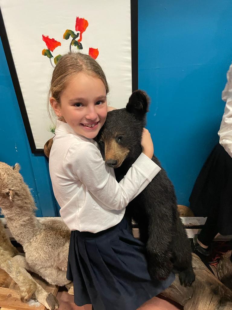 student with bear